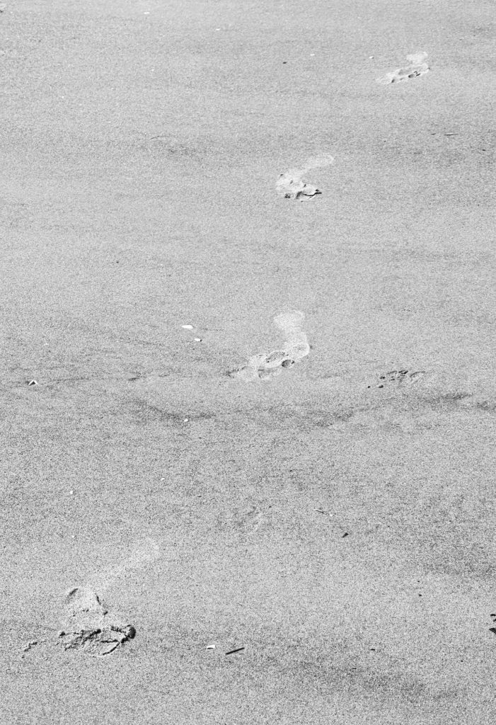 Footsteps on a beach 