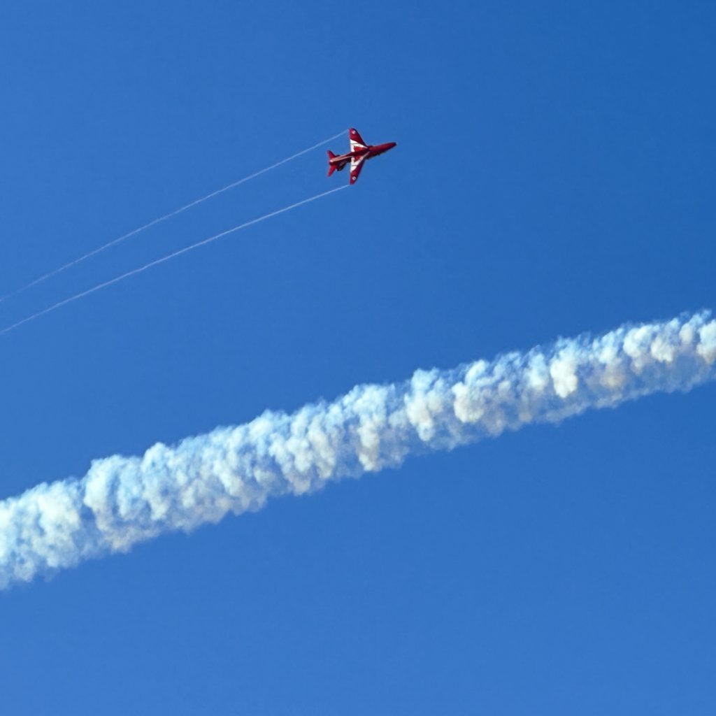 One Red Arrow and a smoke trail